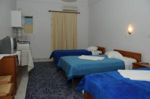 Posteľ alebo postele v izbe v ubytovaní Costa-Rini Hotel