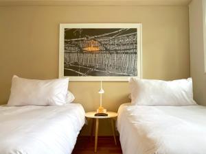 Katil atau katil-katil dalam bilik di Nomad By Wynwood House