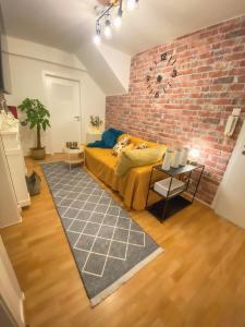 a bedroom with a brick wall and a bed at Daheim in Essen in Essen