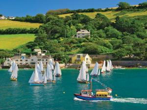 a group of sailboats in a body of water at Upper Marcam House in Salcombe