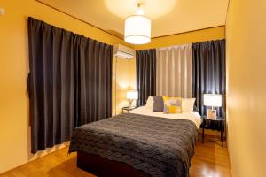 Deluxe Room 130平米 URUMAHOTEL客房内的一张或多张床位