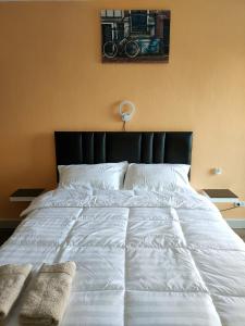 Een bed of bedden in een kamer bij View Talay 1B by Fernando