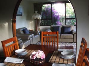 a living room with a table and a couch at Havenlee Homestay in Westport