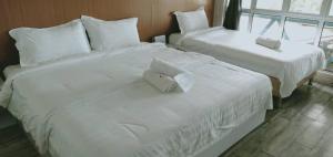 Letto o letti in una camera di Rick Resort Teluk Intan