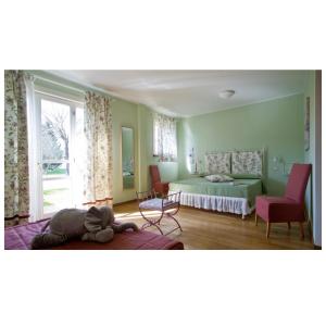 a bedroom with a bed and a room with a window at Cà Del Moro Resort & SPA in Pontremoli +58 photos