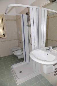 a bathroom with a sink and a toilet at Jonico Guest house .. calabria in Montegiordano