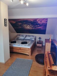 Postel nebo postele na pokoji v ubytování Elza Apartman