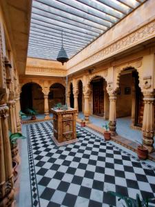 a large room with a black and white checkered floor at Moustache Jaisalmer in Jaisalmer