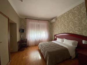 Postel nebo postele na pokoji v ubytování Hotel Kristina
