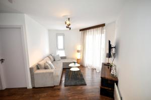 Posezení v ubytování C l e a n&C o z y Apartmani Divcibare