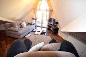 Posezení v ubytování C l e a n&C o z y Apartmani Divcibare