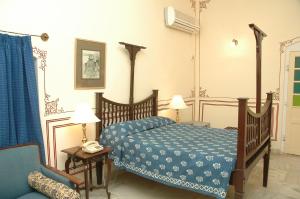 Postel nebo postele na pokoji v ubytování Hotel Castle Mandawa