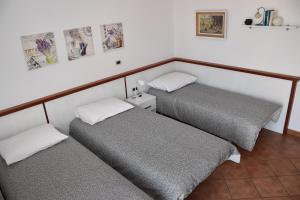 Postel nebo postele na pokoji v ubytování Rooms and Apartments Robert