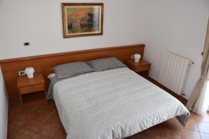 Postel nebo postele na pokoji v ubytování Rooms and Apartments Robert