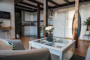 a living room with a white coffee table at Surfer Loft with AC and sun terrace in Bonn