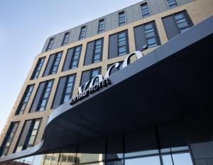 a building with a sign on the front of it at voco Edinburgh - Haymarket, an IHG Hotel in Edinburgh