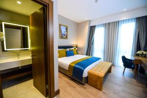 Postel nebo postele na pokoji v ubytování CHER HOTEL & SPA Taksim