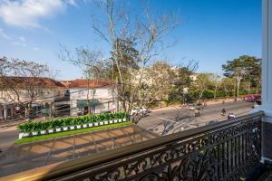 a balcony with a view of a street at La Fleur Premium Central Apartment Hotel in Da Lat