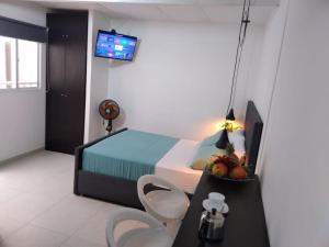 Cama o camas de una habitación en VIP Apartasuites Rosales