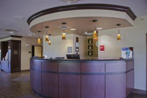 a bar in a hospital lobby with lights at Comfort Suites in Edinboro