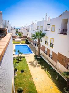 an aerial view of a building with a swimming pool at Cabanas Terraces - Pool and seaview in Tavira