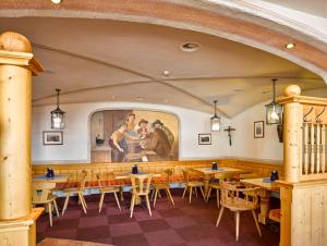 Un restaurante o sitio para comer en Alpengasthof Hochsöll