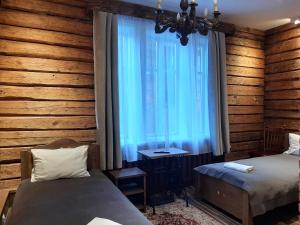 Postel nebo postele na pokoji v ubytování Bojarski Gościniec