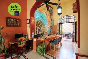 a restaurant with a large mural on the wall at Hotel del Peregrino Boutique Hotel in Mérida