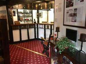 a room with a bar with a desk and a counter at The Sunningdale in Skegness