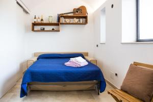 Ένα ή περισσότερα κρεβάτια σε δωμάτιο στο Gioia Infinita +37 φωτογραφίες