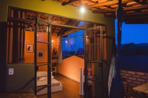 a room with a bunk bed and a window at Vila Clara do Capão in Vale do Capao