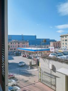 a gas station with a view of a parking lot at AIRPORT HOUSE MARIEl in Genoa