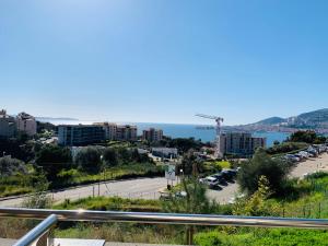 a view of a city with the ocean in the background at T2 Ajaccio vue mer in Ajaccio