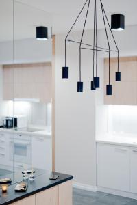 Kuchyňa alebo kuchynka v ubytovaní D Apartments Centrum Jurowiecka II