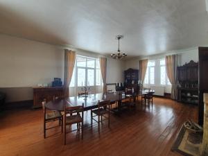 a dining room with a large table and chairs at Chateau de Bonnevaux in Villeneuve-de-Marc