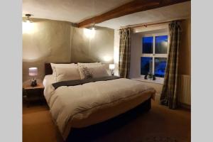 En eller flere senge i et værelse på Cranmore House - a walkers' and cyclists' dream