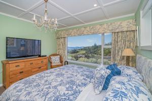 En eller flere senge i et værelse på Bayview Valley Lodge Bed & Breakfast