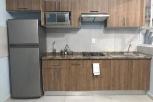 Virtuvė arba virtuvėlė apgyvendinimo įstaigoje Brand new apartment, charming and family-friendly