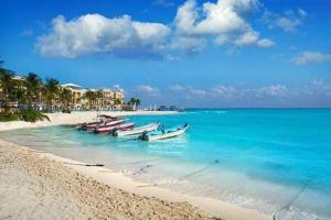 a group of boats sitting on the beach at Brand new apartment, charming and family-friendly in Playa del Carmen