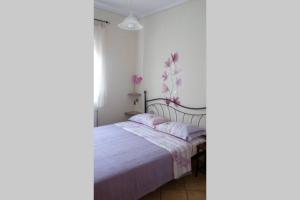 Katil atau katil-katil dalam bilik di Cosy flat in the center of Kalithea,Chalkidiki