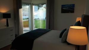 A bed or beds in a room at Serenity Azores - Casa da Aldeia