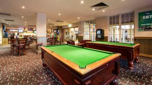 a billiard room with two pool tables in it at Nightcap at Sylvania Hotel in Campbellfield
