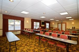 a conference room with tables and chairs in it at Country Inn & Suites by Radisson, Stevens Point, WI in Stevens Point +38 photos