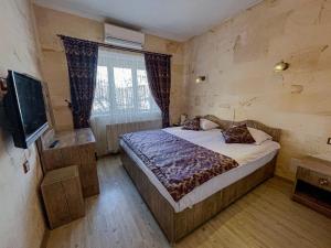 Llit o llits en una habitació de Yusuf Bey House