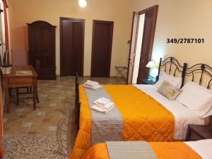 Posteľ alebo postele v izbe v ubytovaní B&B Batarà - "La Terrazza del Centro"