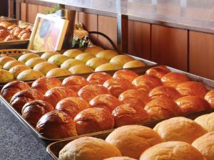 a display of breads and pastries in a bakery at Kinugawa Plaza Hotel in Nikko