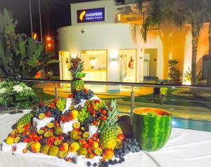 a pile of fruit sitting on top of a table at Ganimede Hotel in Sperlonga