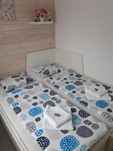 Posteľ alebo postele v izbe v ubytovaní Apartment Moravský Kras