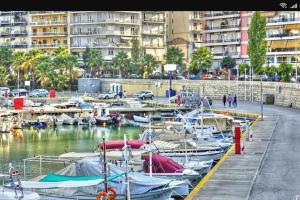 a bunch of boats docked in a harbor with buildings at CENTRAL TOWN HOUSE 60m2**** in Piraeus