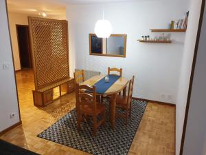 a dining room with a table and chairs at Céntrico, amplio y bonito apartamento en Cambados in Cambados +22 photos